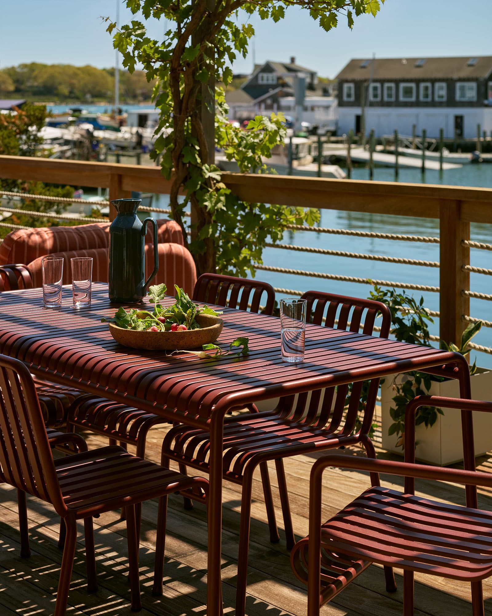 Outdoor table set toward the water.
