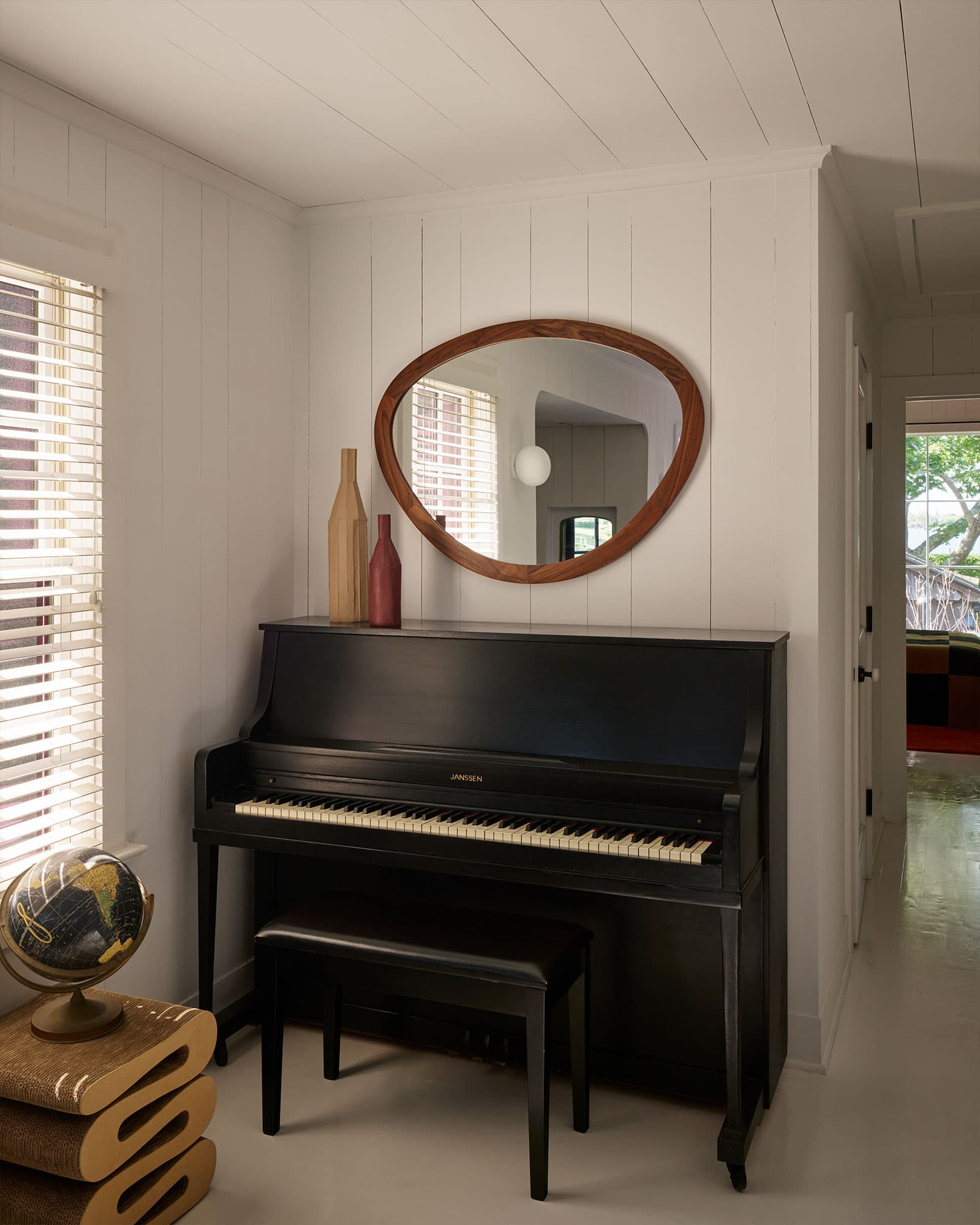 Grand piano in the screen-free parlor.