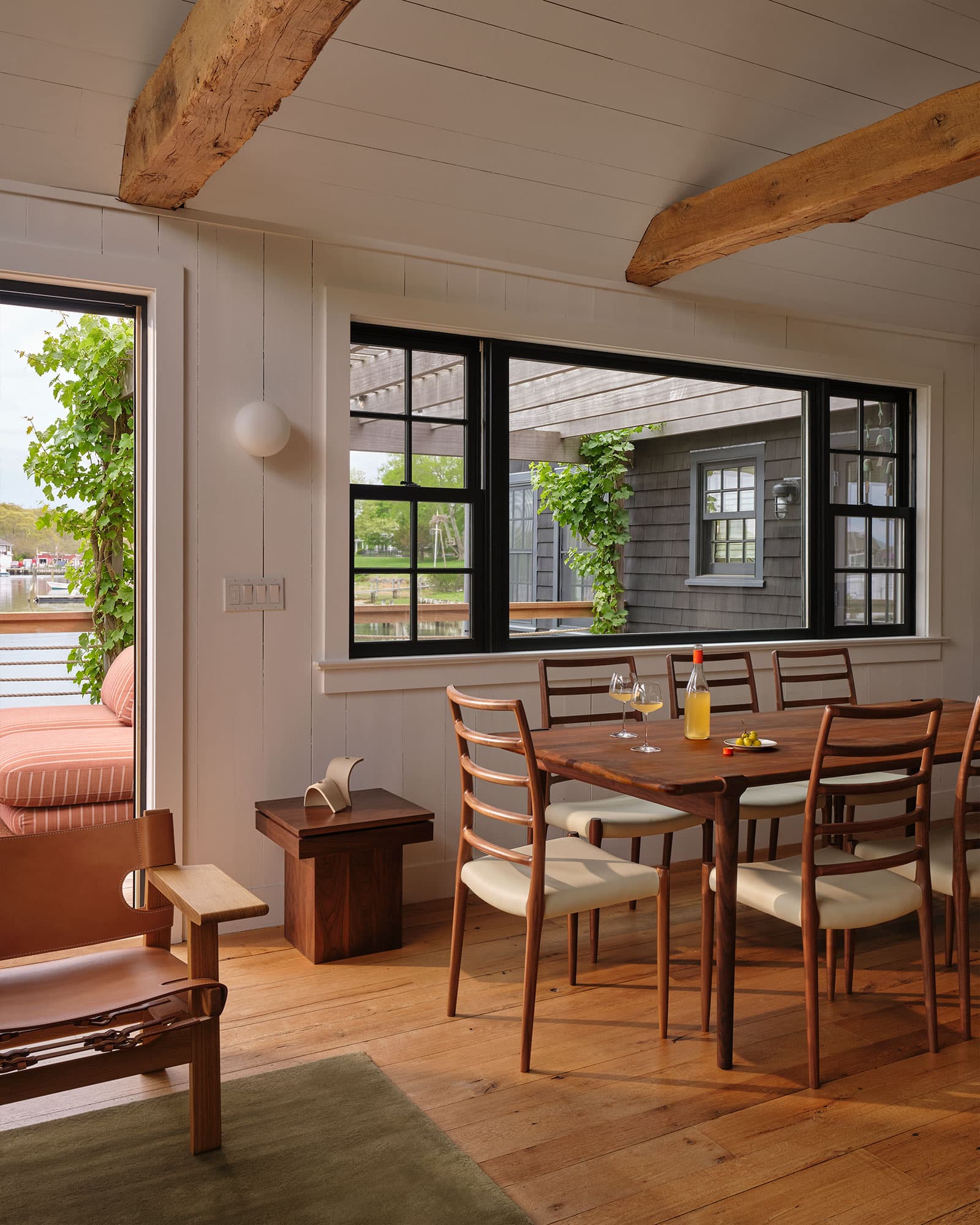 Dining at the window, harbor outside.